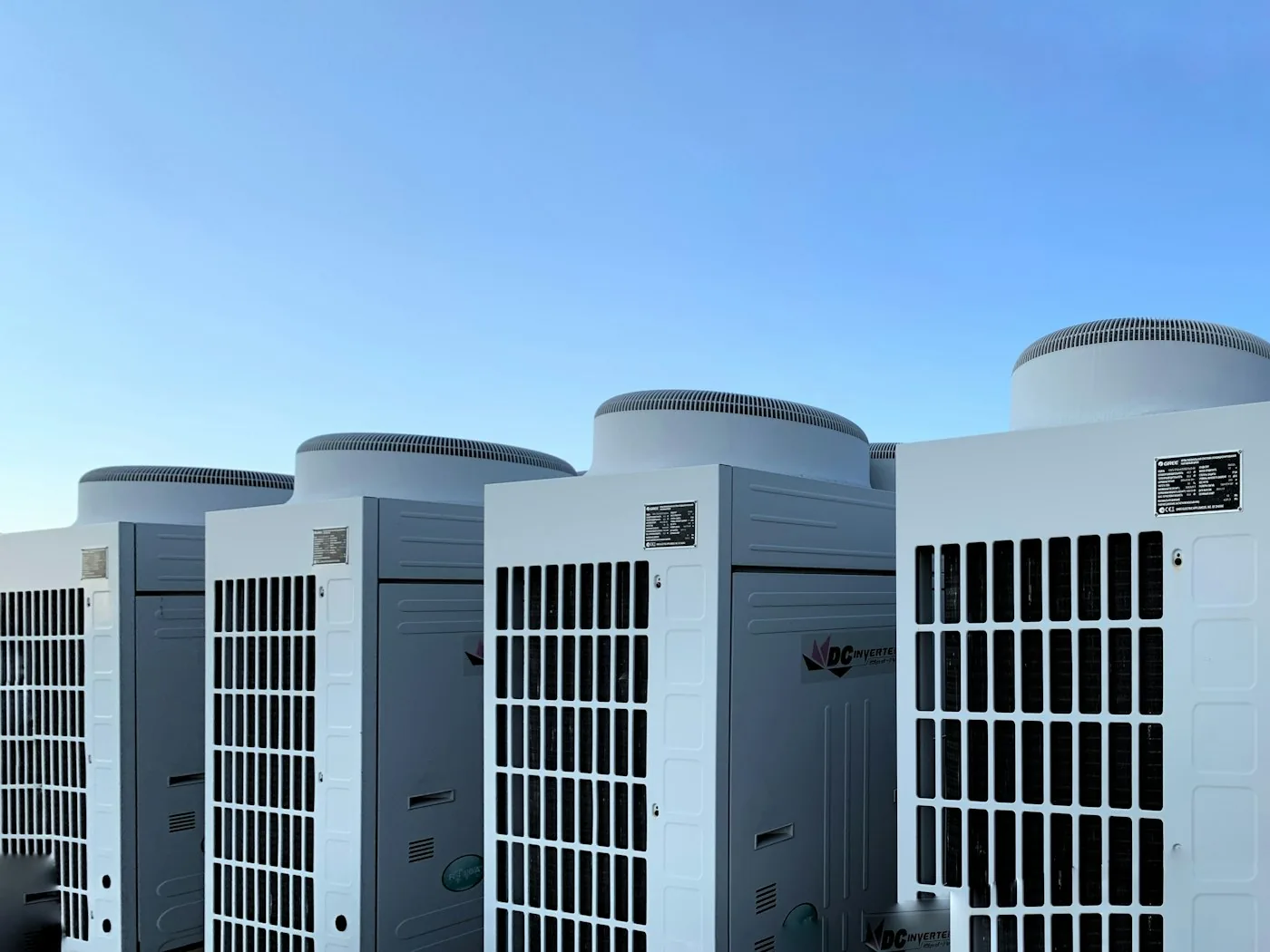 Row of large commercial HVAC condenser units