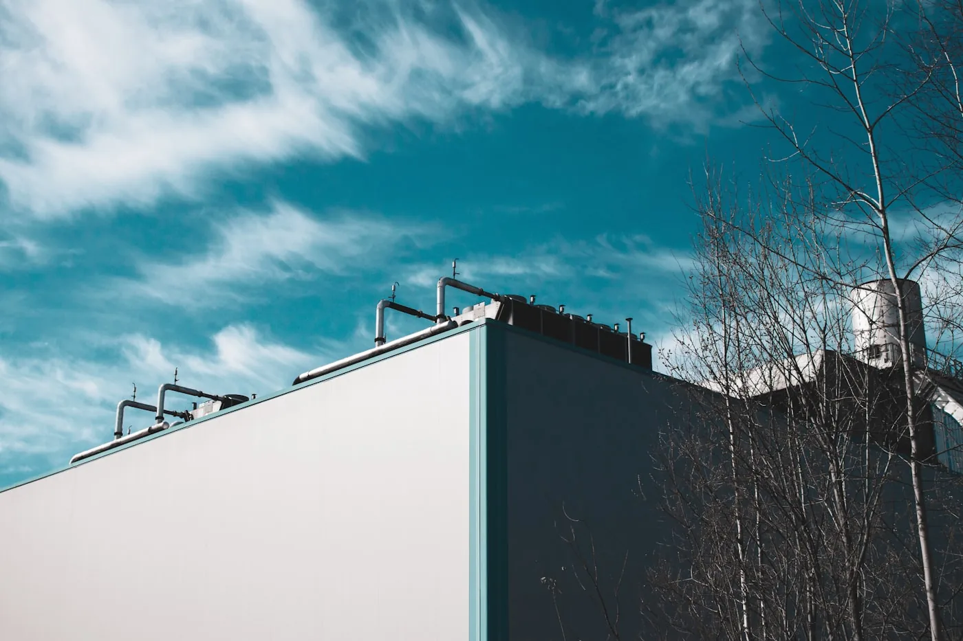 Commercial rooftop HVAC plant against an open sky