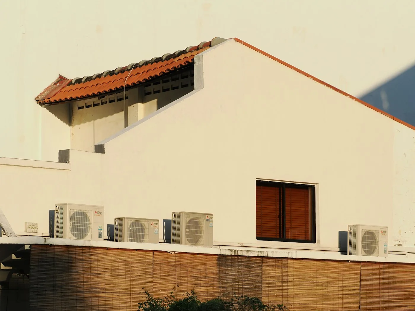 White HVAC rooftop condensing units installed on a commercial building