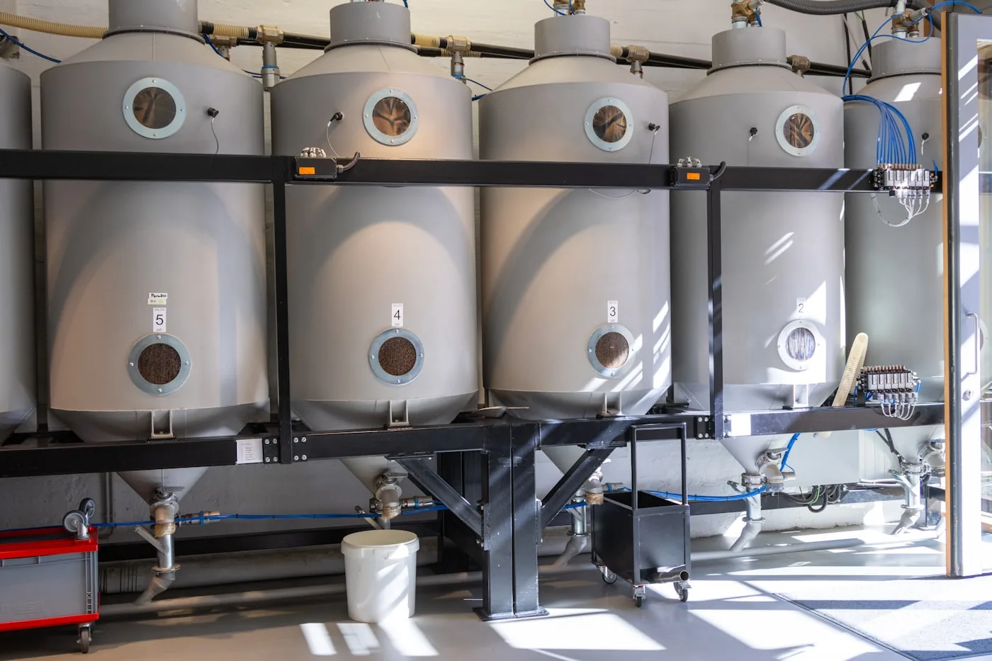 Row of heating system storage tanks in a plant room