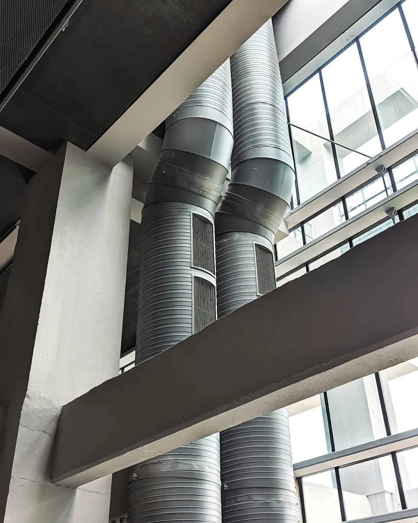 Metal HVAC ventilation pipes on a building exterior