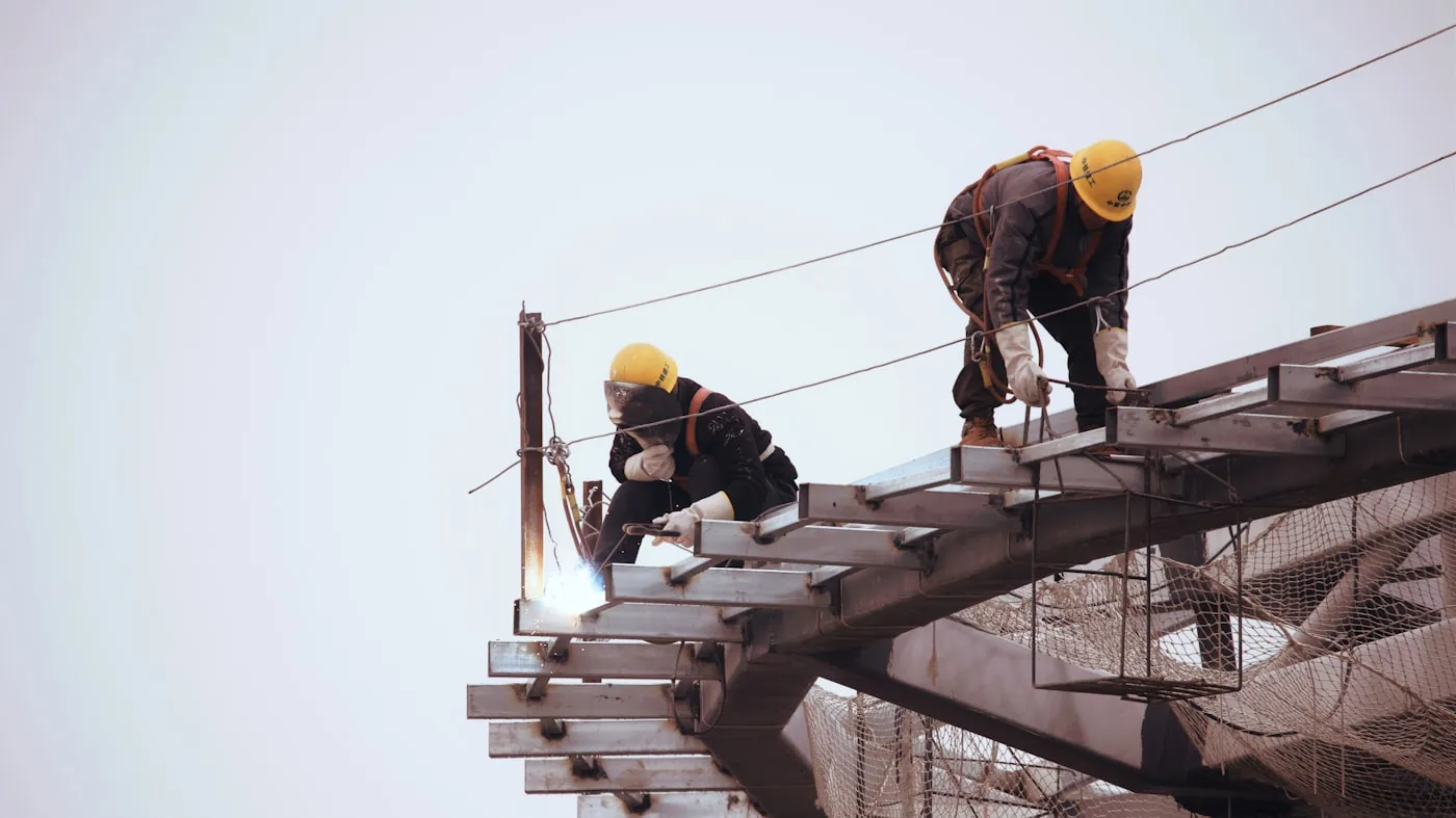 Roofing worker in a hard hat during a roof replacement
