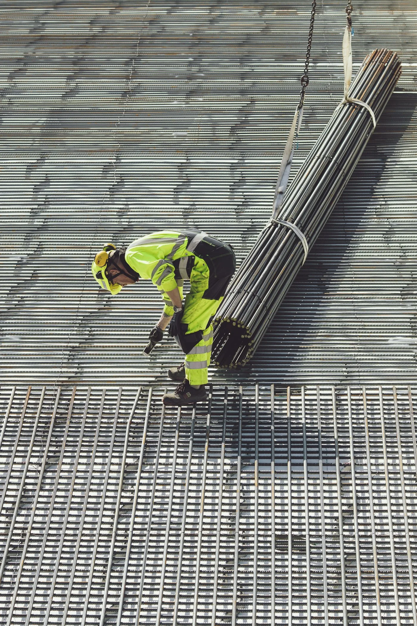 Roofing worker installing metal roof decking