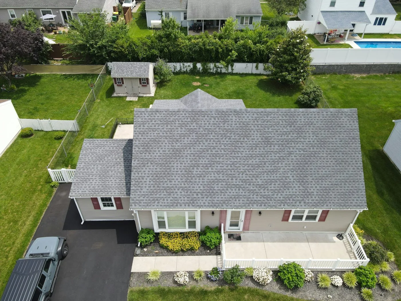 Aerial view of asphalt shingle roofs across a suburban neighbourhood