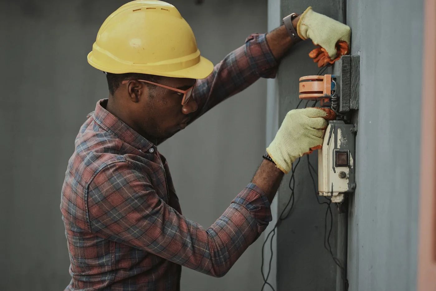 HVAC contractor wearing a hard hat on a job site