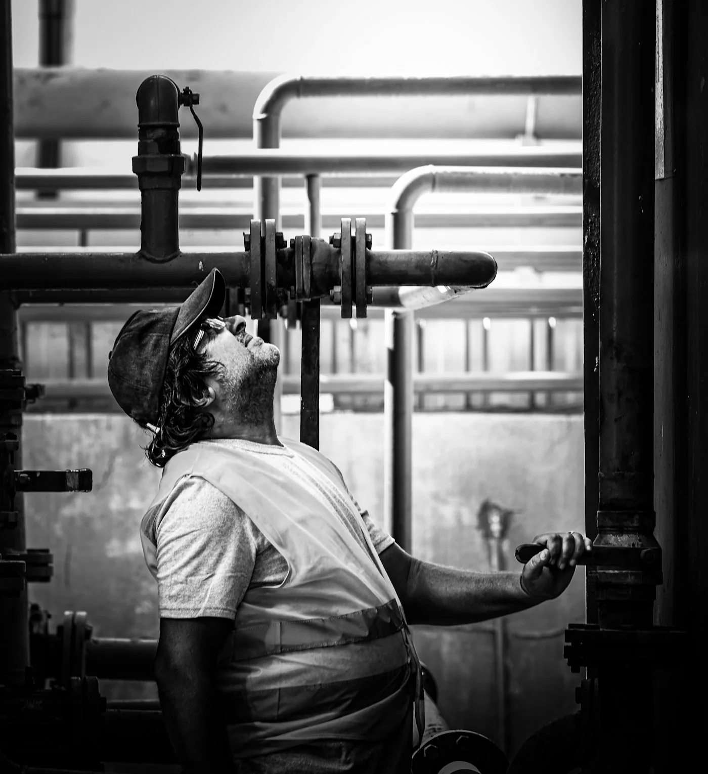 HVAC technician inspecting industrial pipework