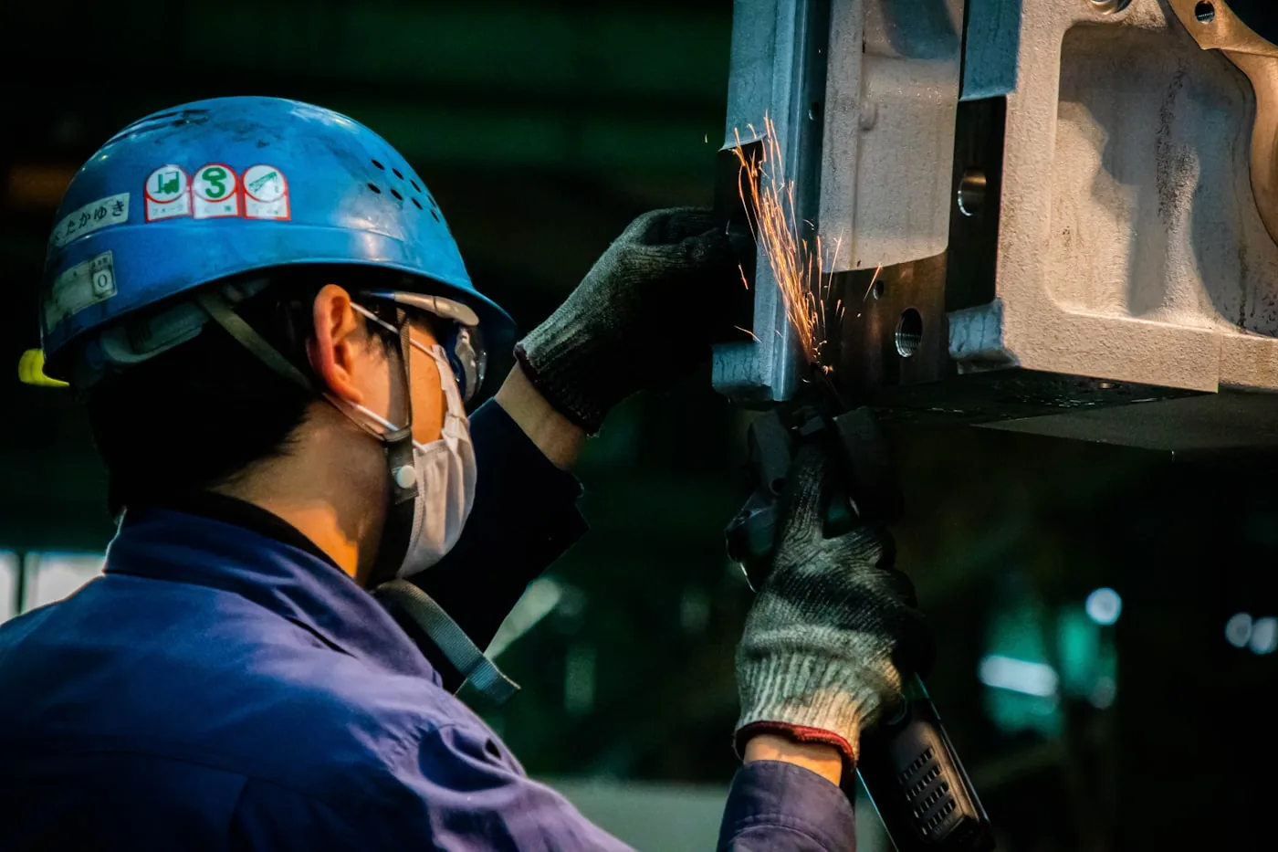 HVAC field technician in safety helmet on a service call