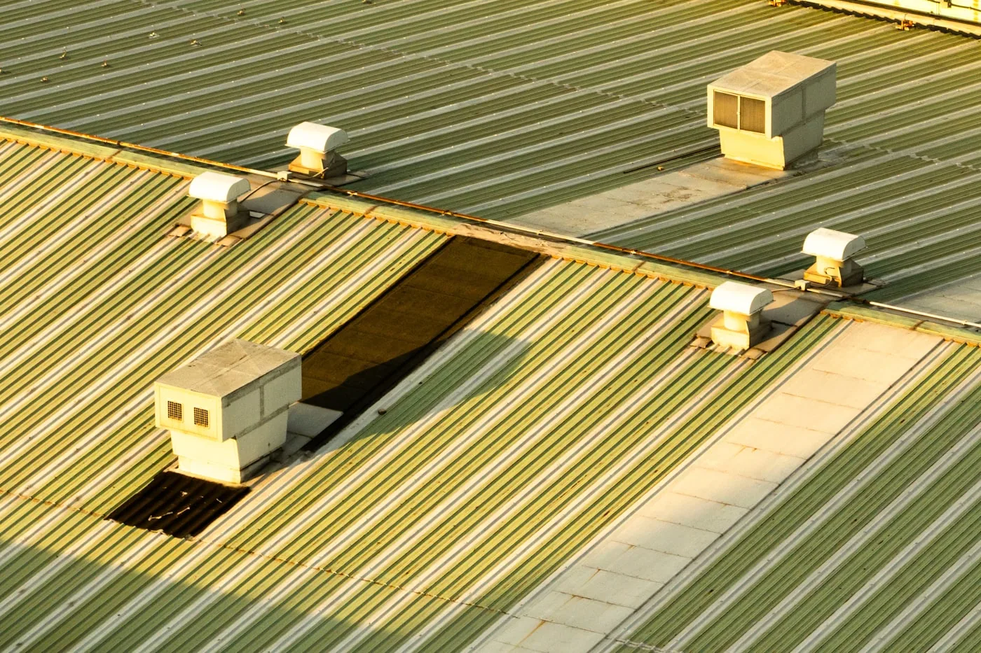 Ventilation stacks on a standing seam metal roof
